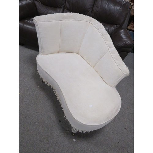 752 - A shaped upholstered small chaise longue