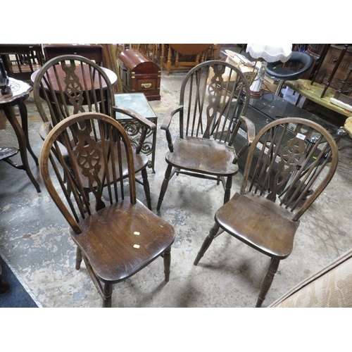 757 - An oak refectory style table together with wheel back chairs