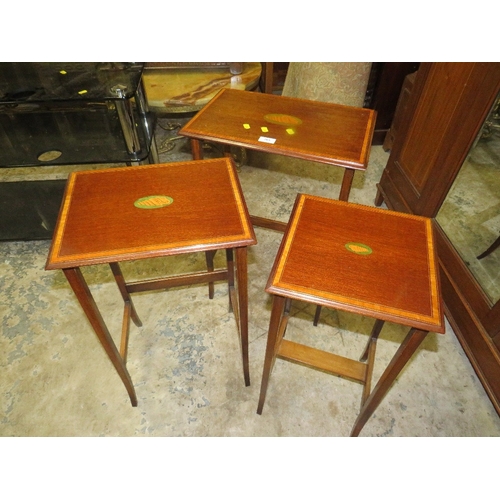 763 - An Edwardian mahogany inlaid nest of tables