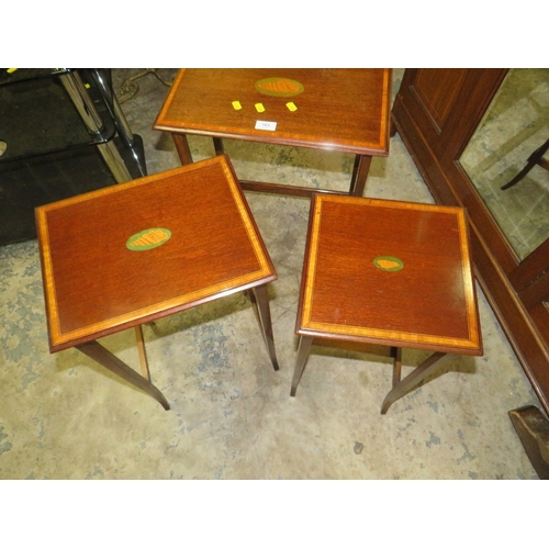 763 - An Edwardian mahogany inlaid nest of tables