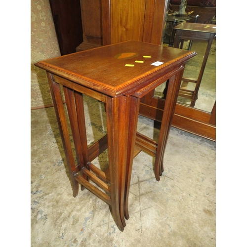 763 - An Edwardian mahogany inlaid nest of tables