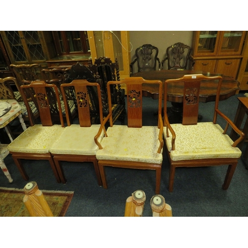 769 - A set of four eastern style hardwood dining chairs