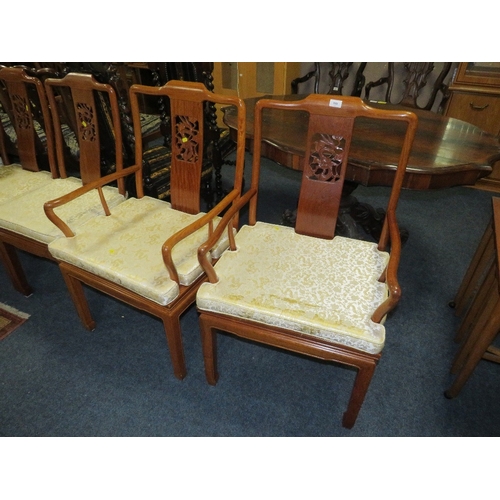 769 - A set of four eastern style hardwood dining chairs