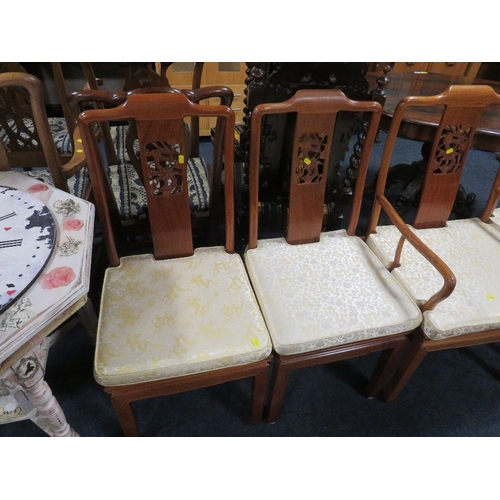 769 - A set of four eastern style hardwood dining chairs