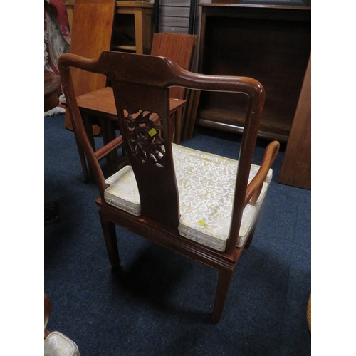 769 - A set of four eastern style hardwood dining chairs