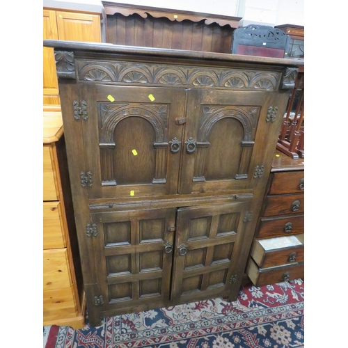 775 - A carved oak drinks cabinet W 94 cm