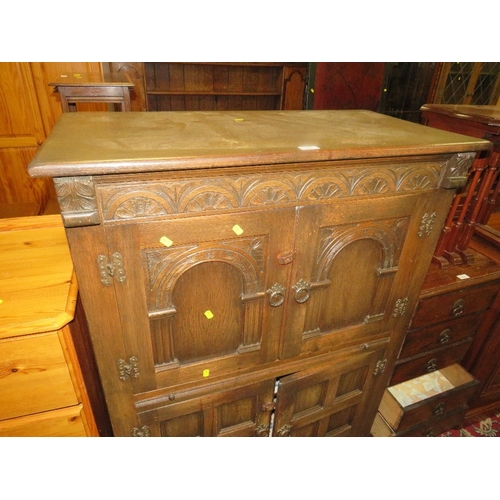 775 - A carved oak drinks cabinet W 94 cm