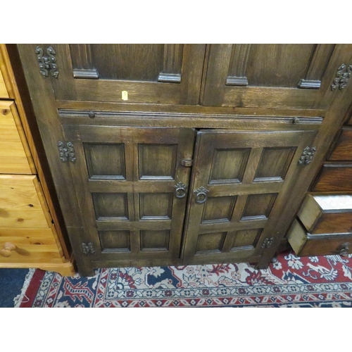 775 - A carved oak drinks cabinet W 94 cm