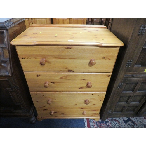 777 - A modern honey pine four drawer chest together with a fire screen (2)