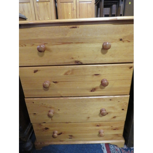 777 - A modern honey pine four drawer chest together with a fire screen (2)