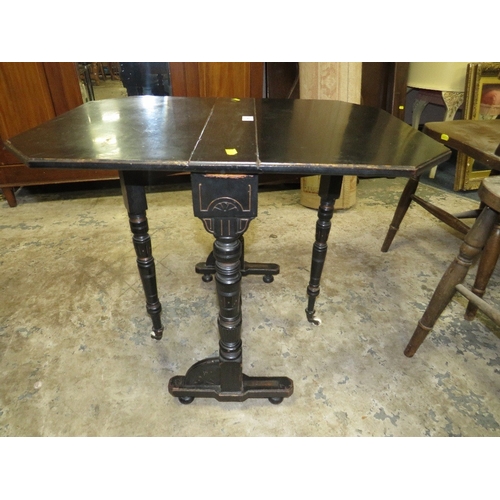 781 - A small Edwardian ebonized aesthetic period sutherland table