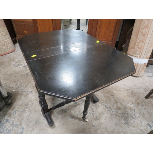 781 - A small Edwardian ebonized aesthetic period sutherland table