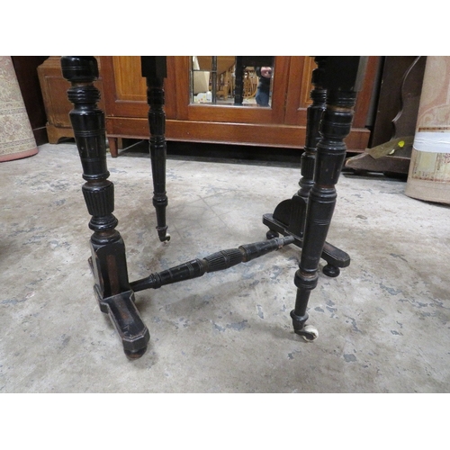 781 - A small Edwardian ebonized aesthetic period sutherland table