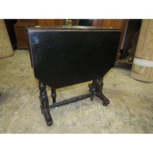 781 - A small Edwardian ebonized aesthetic period sutherland table