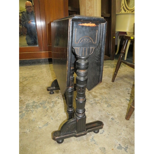 781 - A small Edwardian ebonized aesthetic period sutherland table