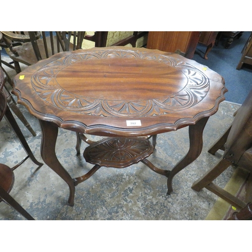 782 - A carved mahogany two tier occasional table together with a circular example. (2)