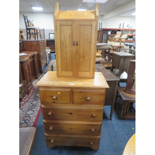 788 - A honey pine five drawer chest together with a two door light oak cabinet. (2)