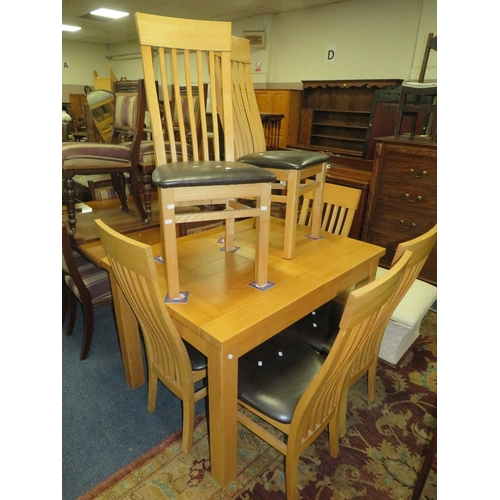 796 - A modern light oak extending dining table and six chairs