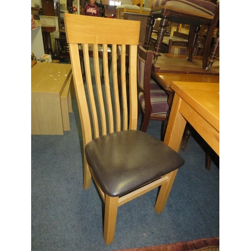 796 - A modern light oak extending dining table and six chairs