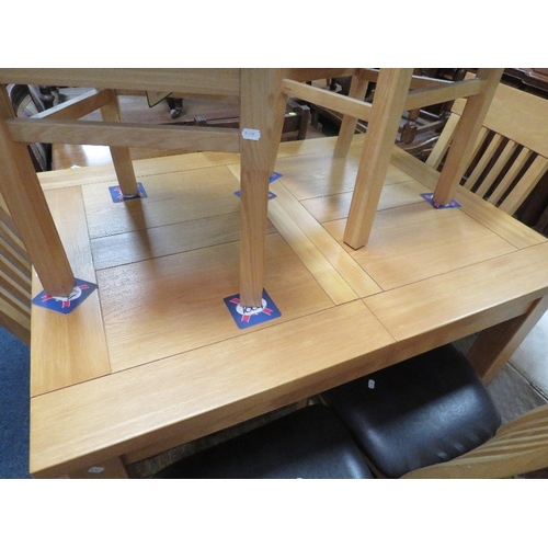 796 - A modern light oak extending dining table and six chairs