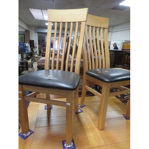 796 - A modern light oak extending dining table and six chairs