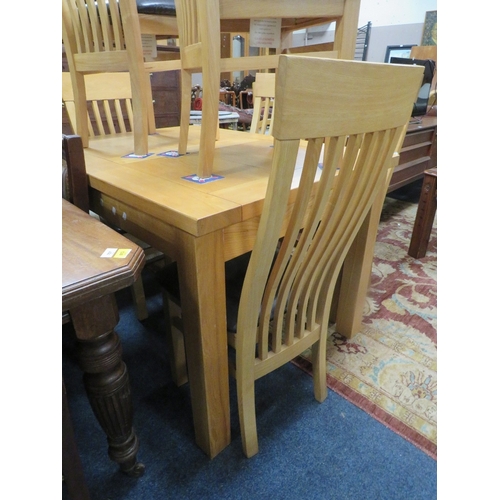 796 - A modern light oak extending dining table and six chairs