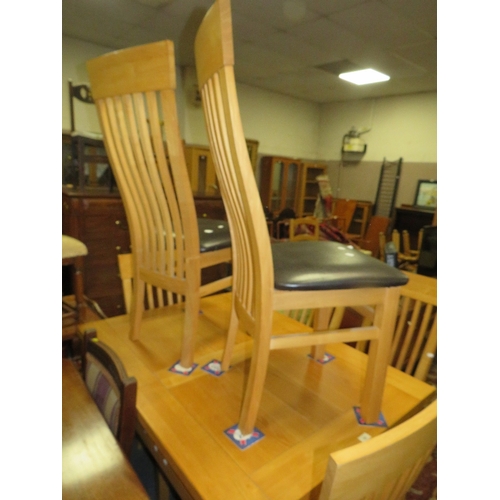 796 - A modern light oak extending dining table and six chairs