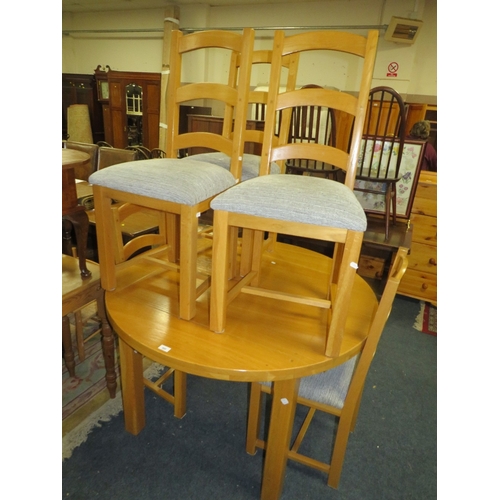 800 - A modern light oak extending dining table and six chairs