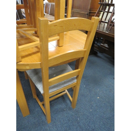 800 - A modern light oak extending dining table and six chairs