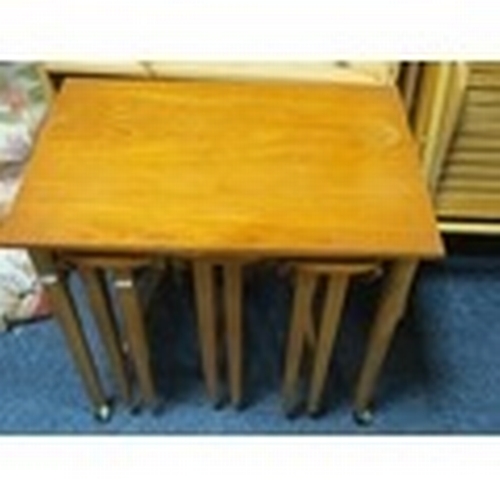 811 - A retro teak nest of three tables