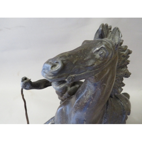 182 - A spelter style figure of a man on a horse