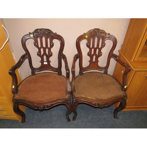 773 - A pair of antique mahogany carved bergere seat armchairs A/F