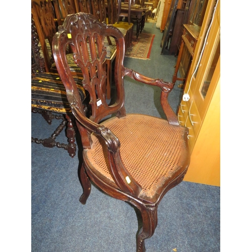 773 - A pair of antique mahogany carved bergere seat armchairs A/F