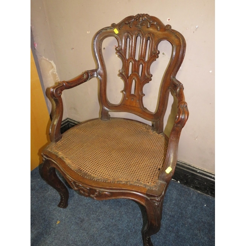 773 - A pair of antique mahogany carved bergere seat armchairs A/F