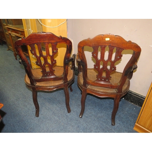 773 - A pair of antique mahogany carved bergere seat armchairs A/F