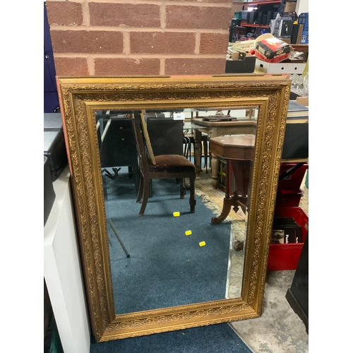 741 - A modern heavy gilt framed rectangular wall mirror 110 x 79 cm