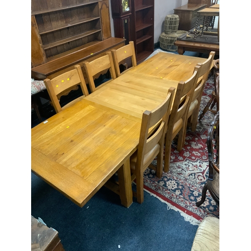 758 - A modern heavy oak extending dining table and six chairs