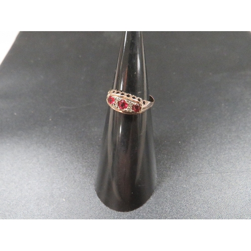 327 - A 9ct gold ring set with rubies and small diamonds approx. 1.4g