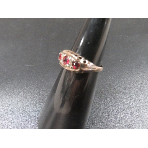 327 - A 9ct gold ring set with rubies and small diamonds approx. 1.4g