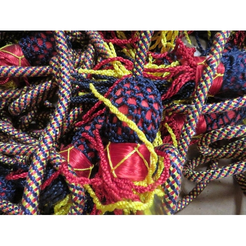 100 - A tray of military bugle rope braid