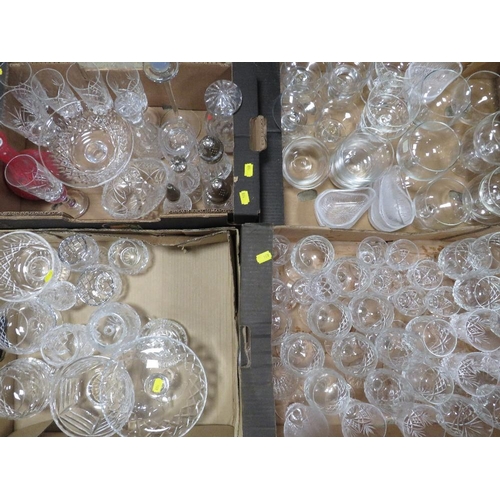 103 - A large quantity of cut glass and crystal over several trays to include wine glasses, brandy glasses... 