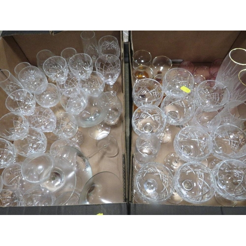 103 - A large quantity of cut glass and crystal over several trays to include wine glasses, brandy glasses... 