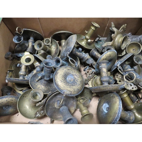 108 - A tray of assorted brass candlesticks etc