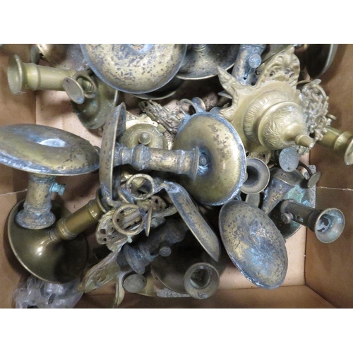 108 - A tray of assorted brass candlesticks etc