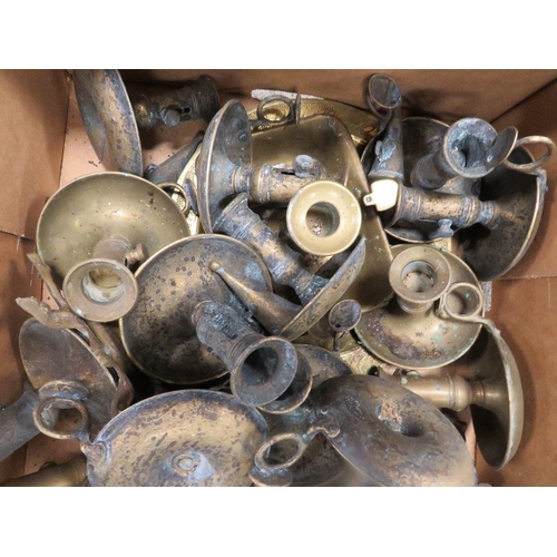 108 - A tray of assorted brass candlesticks etc