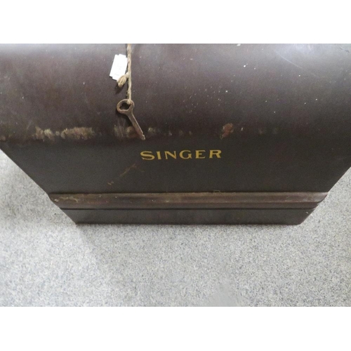 135 - A cased Singer sewing machine together with a cased Winfield example