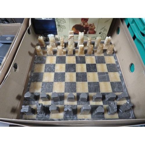 140 - A tray of collectables to include a marble style chess set, watch etc