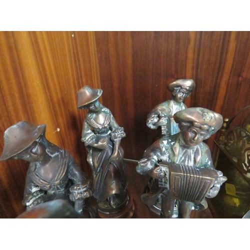 189 - A brass mantel clock together with six cast metal figures