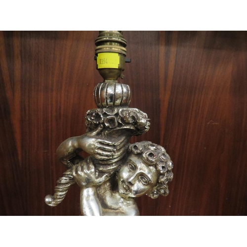 193 - A silver gilt effect table cherub lamp