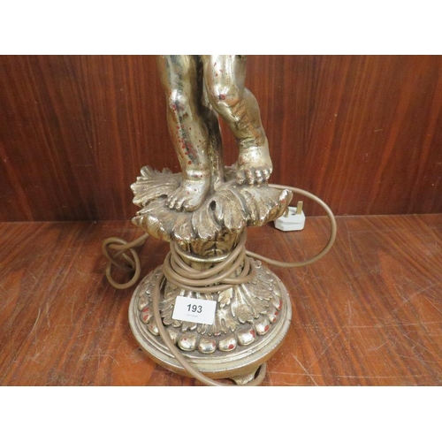 193 - A silver gilt effect table cherub lamp